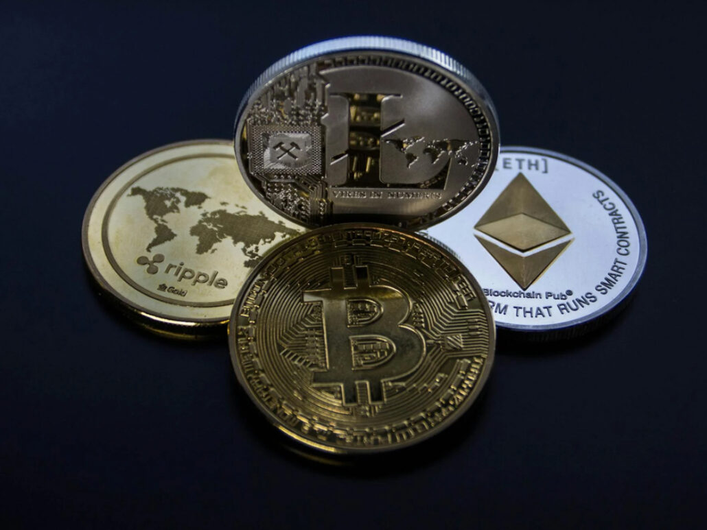 Cryptocurrency coins including Bitcoin, Litecoin, Ethereum, and Ripple.